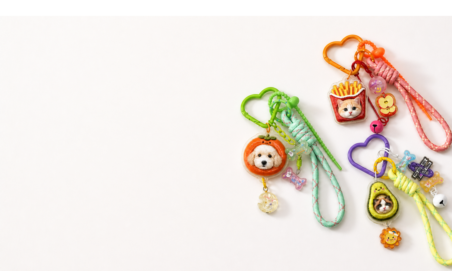 Three colorful personalized pet charm keychains
