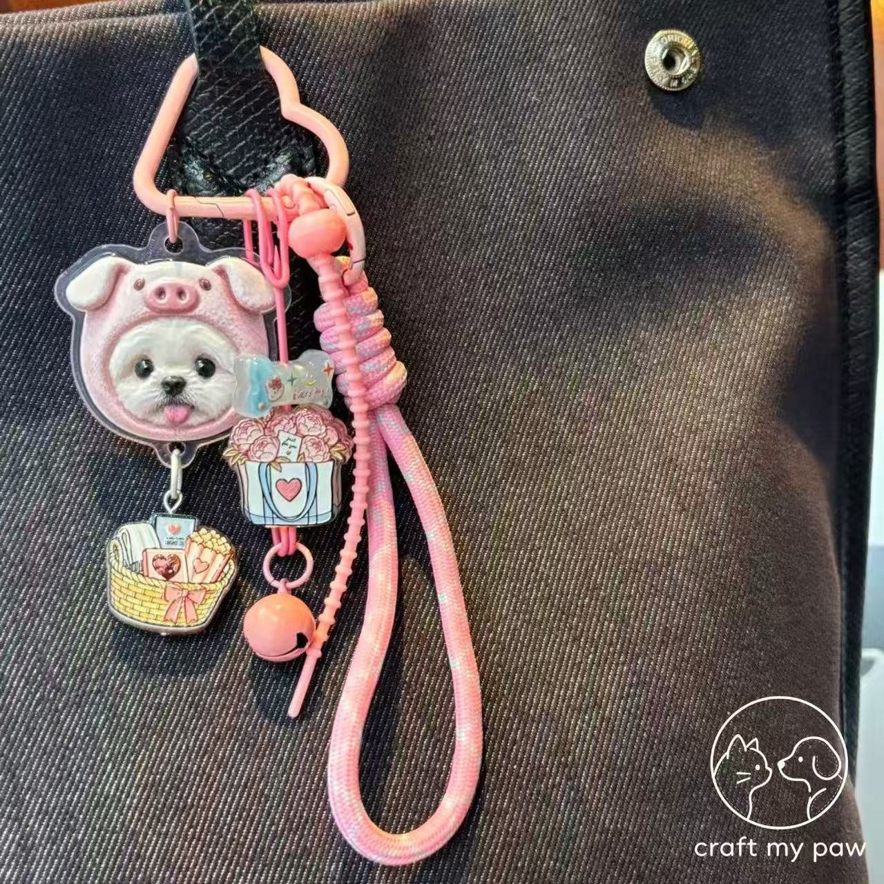 Custom 3D pet bag charm with a pink pig character hood on a black denim bag
